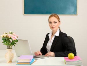 Portrait of teacher woman working in classroom